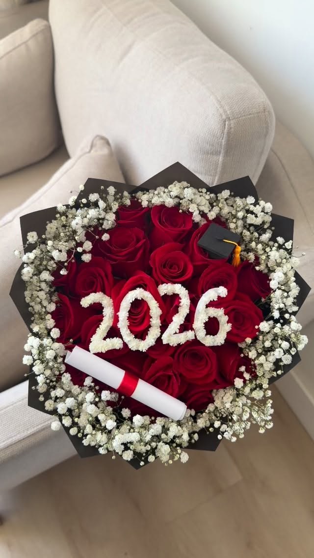 Red roses with a baby's-breath '2026', a grad cap and a diploma